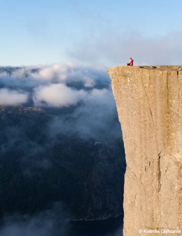woman sitting on a mountain